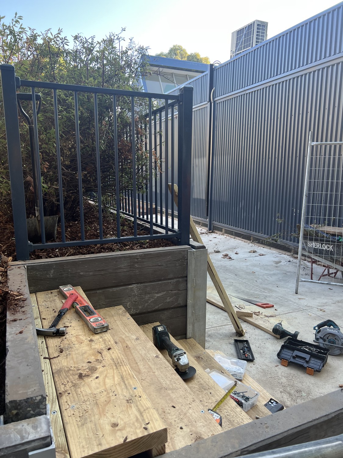Gate and fence preparation beside a boundary