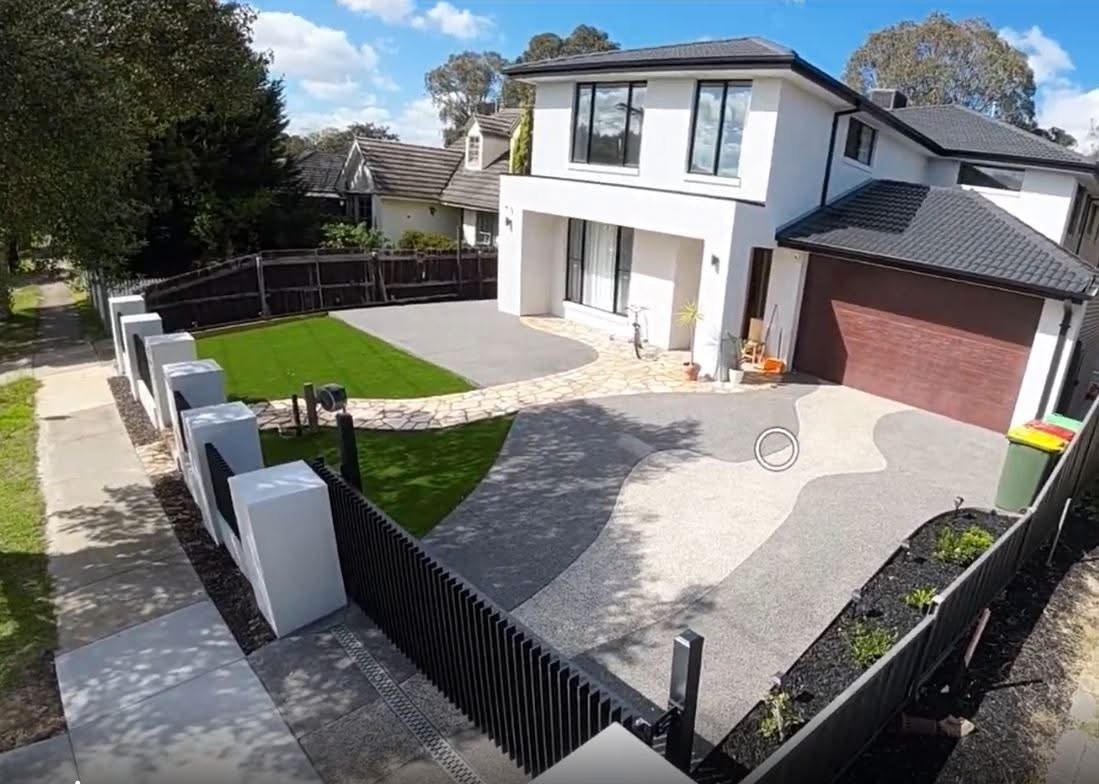 Finished front yard with lawn walls and concrete