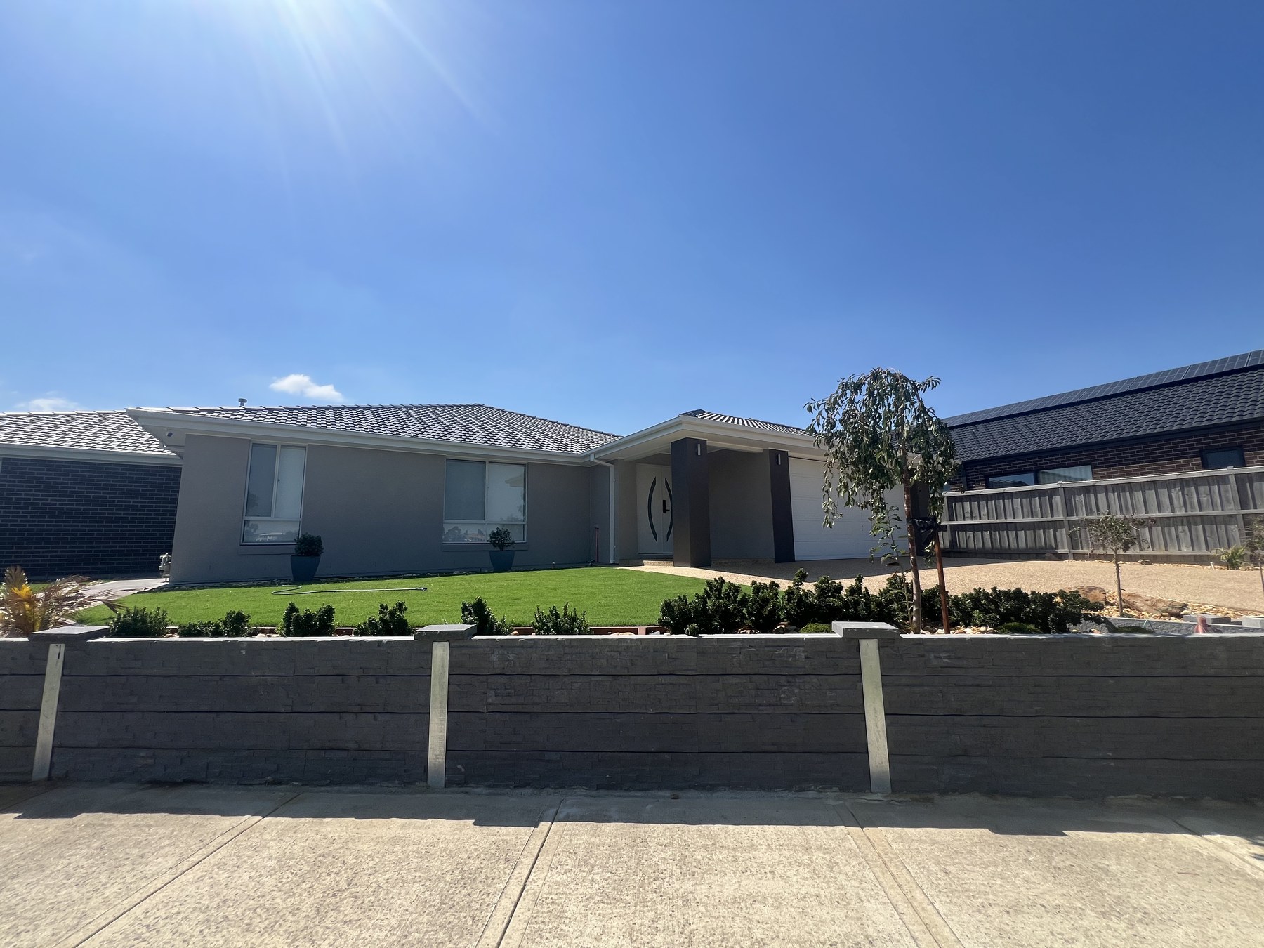 Completed concrete sleeper retaining wall frontage